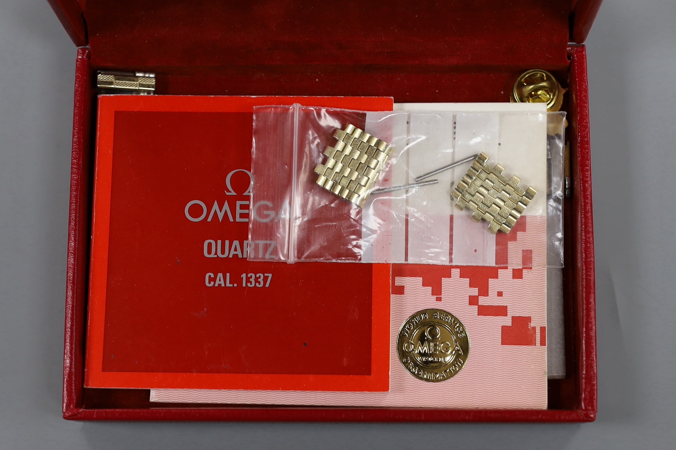 A gentleman's steel and gold plated Omega Seamaster quartz wrist watch, with spare links and Omega box.